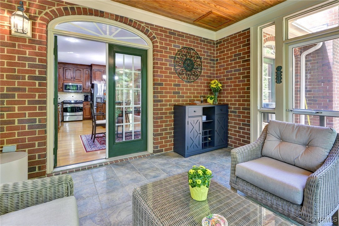 7 Hague Close Williamsburg, VA 23185 - Photo 46 of 50 a view of a patio with couches table and chairs and potted plants