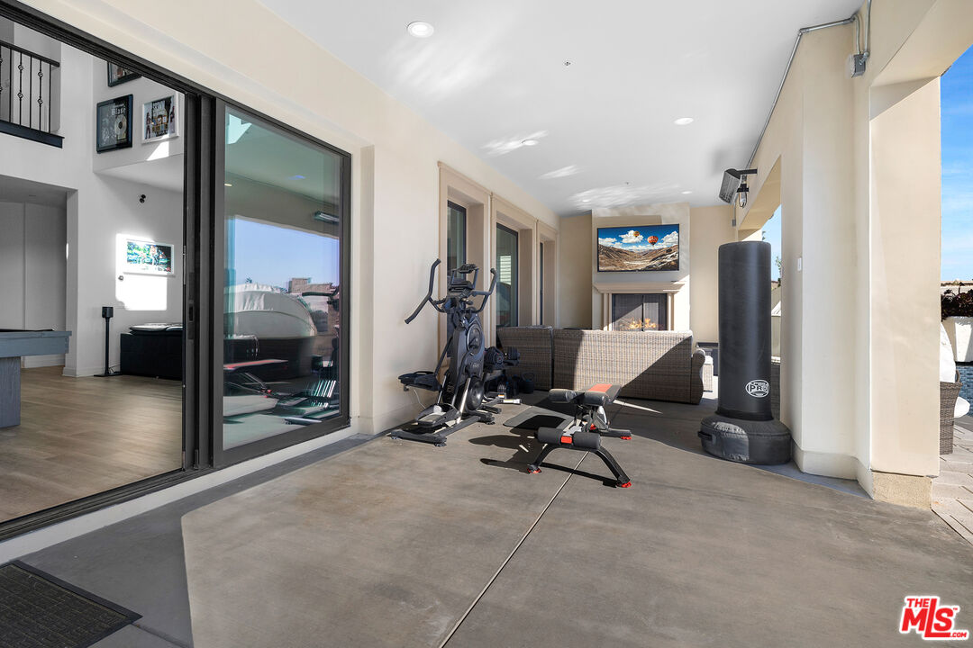 20234 Jubilee Way Porter Ranch, CA 91326 - Photo 14 of 30 a view of a room with gym equipment