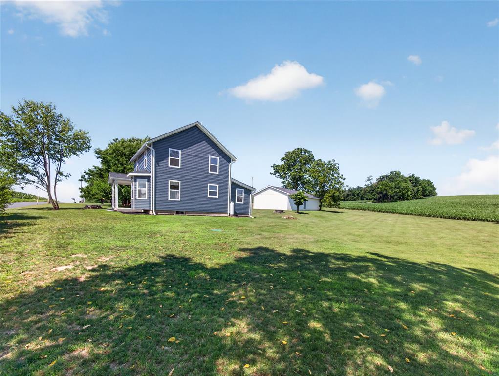 291 East Dannersville Road Bath, PA 18014 - Photo 9 of 46 A classic blue residence sits amidst a generous, verdant lawn with mature trees and open fields.