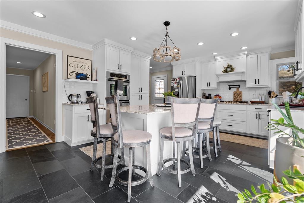 2526 Pounds Avenue Tyler, TX 75701 - Photo 11 of 25 a large kitchen with a table and chairs in it