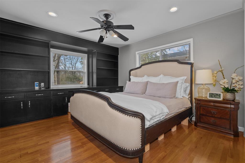 2526 Pounds Avenue Tyler, TX 75701 - Photo 19 of 25 a bedroom with a bed and dresser with mirror