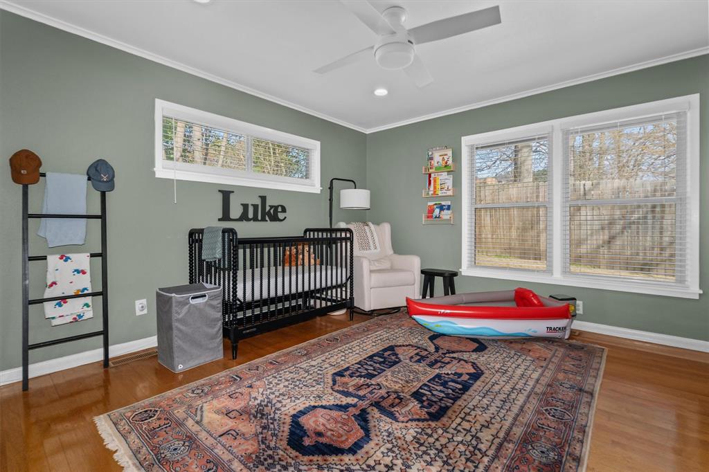2526 Pounds Avenue Tyler, TX 75701 - Photo 20 of 25 a bedroom with a bed and wooden floor