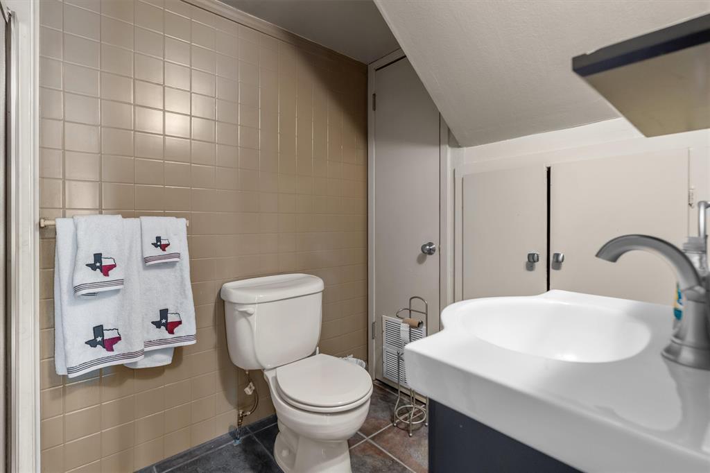 2526 Pounds Avenue Tyler, TX 75701 - Photo 25 of 25 a bathroom with a sink toilet and a mirror