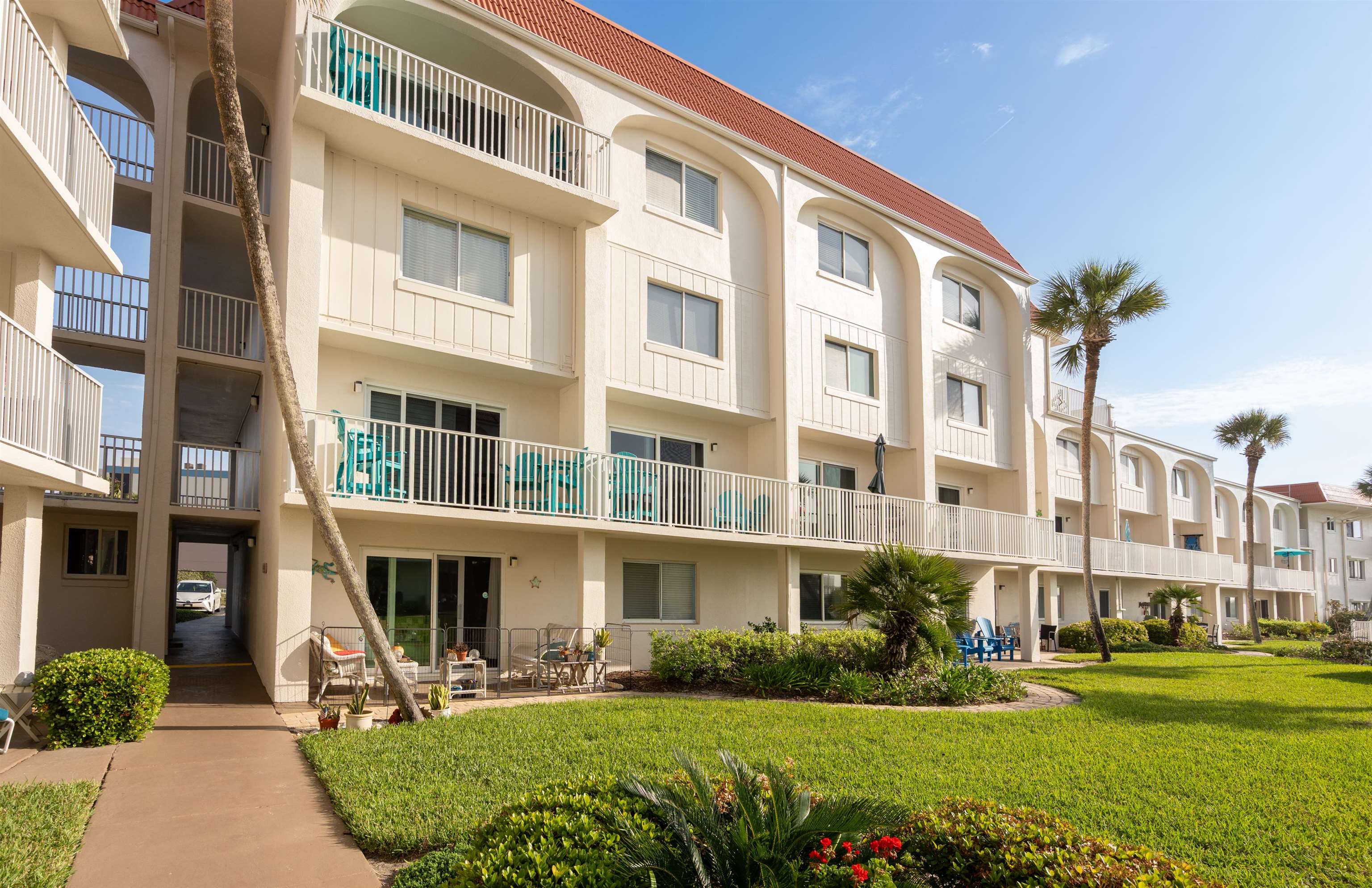 1 Ocean Trace Road, Unit 232 St. Augustine, FL 32080 - Photo 24 of 49 a front view of a building with a garden