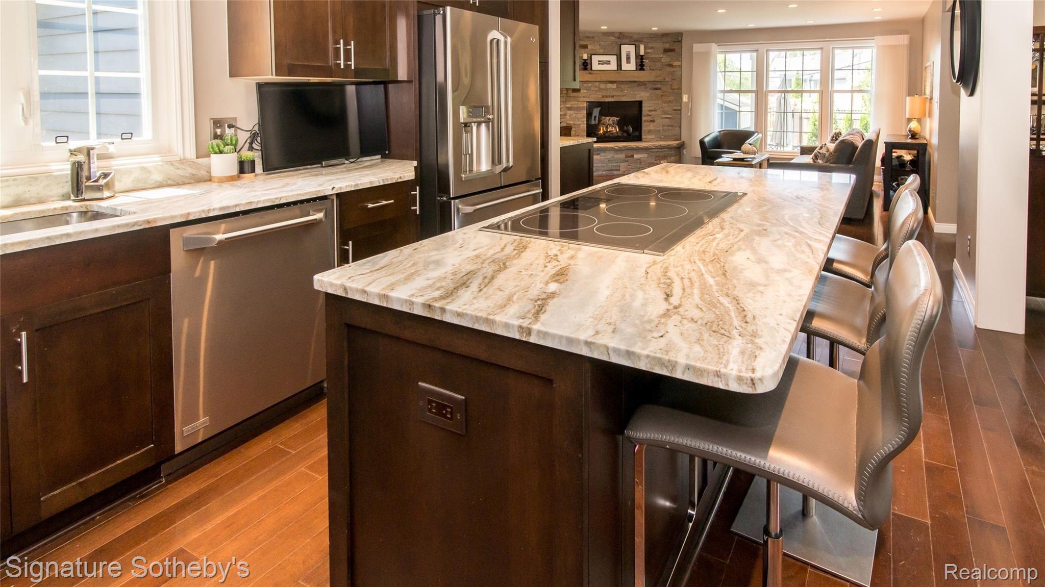 263 Ravine Road Birmingham, MI 48009 - Photo 15 of 79 019_18.jpg Kitchen island and view into family room fireplace