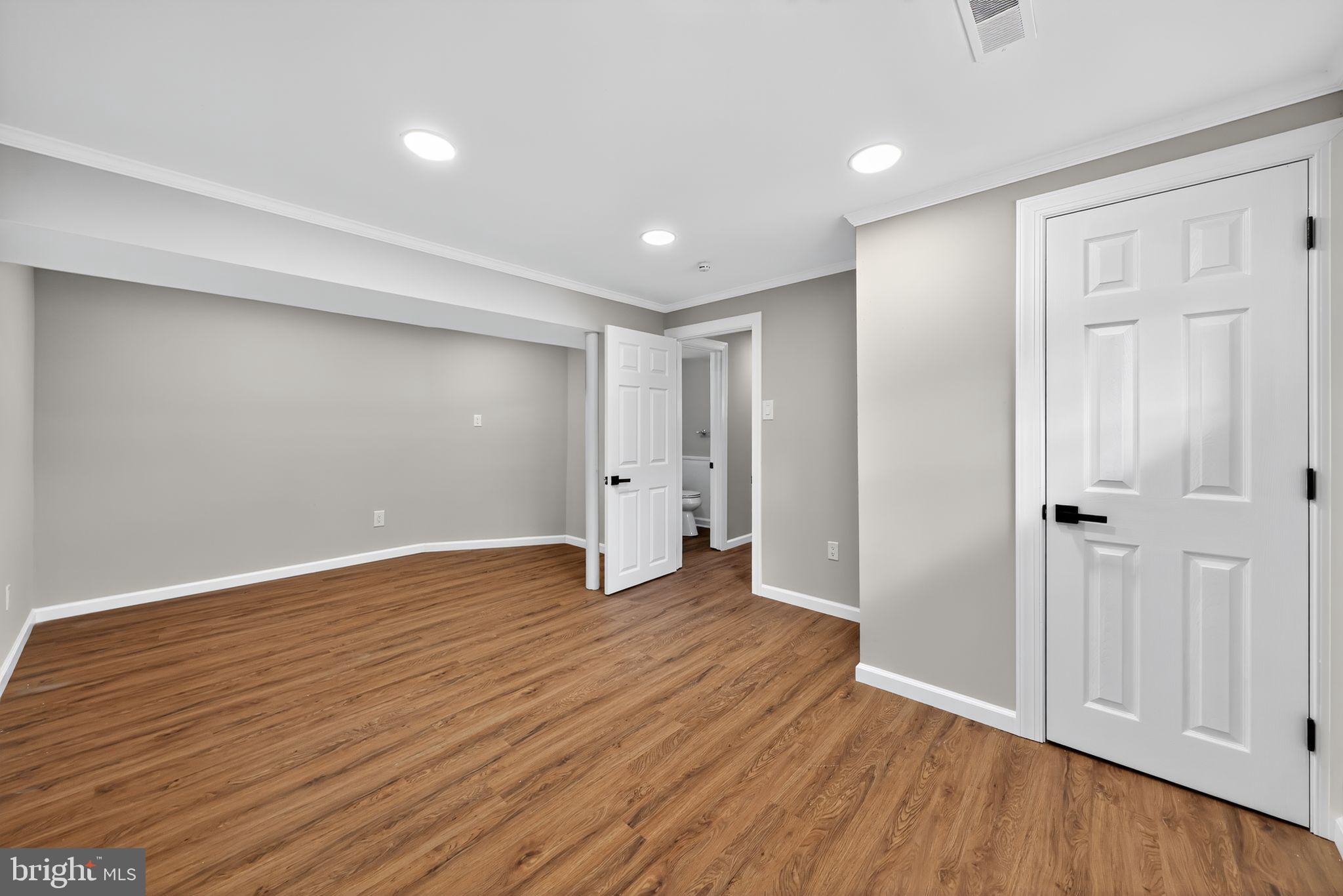 500 New York Road Browns Mills, NJ 08015 - Photo 12 of 21 a view of an empty room with wooden floor