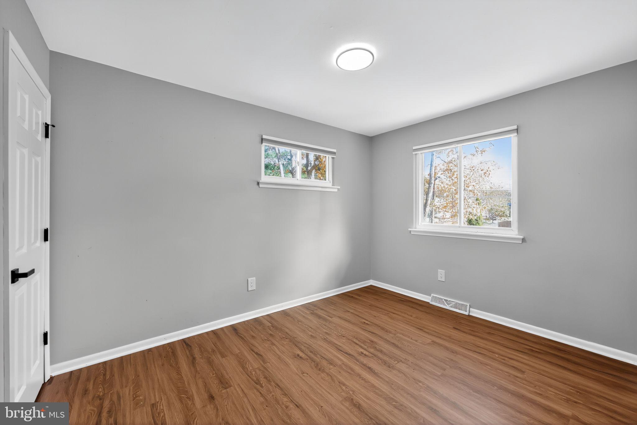500 New York Road Browns Mills, NJ 08015 - Photo 13 of 21 a view of room with wooden floor and window
