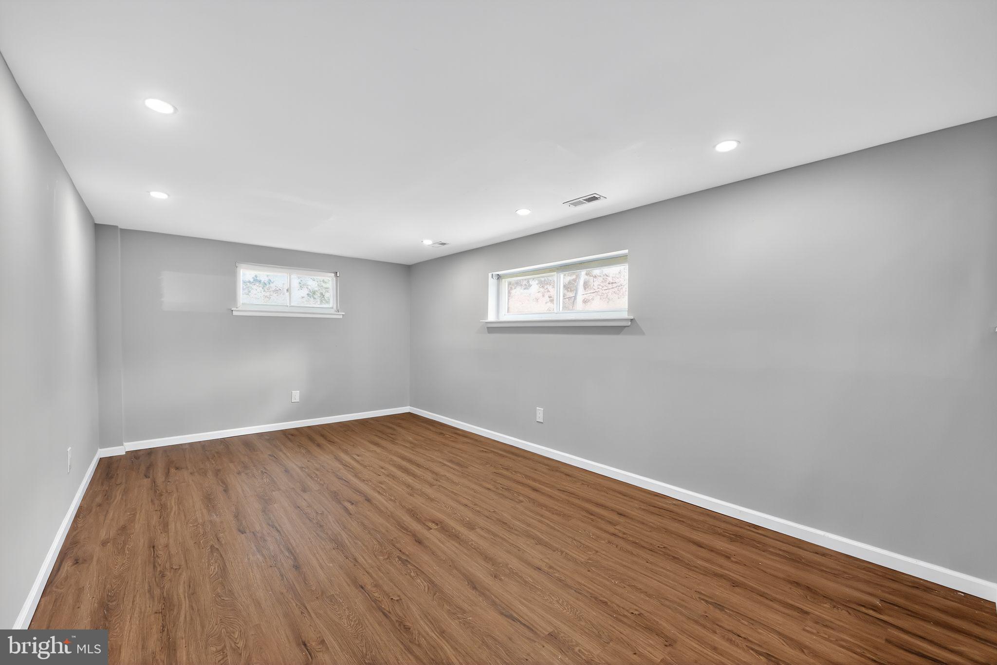 500 New York Road Browns Mills, NJ 08015 - Photo 17 of 21 a view of an empty room with wooden floor and a window