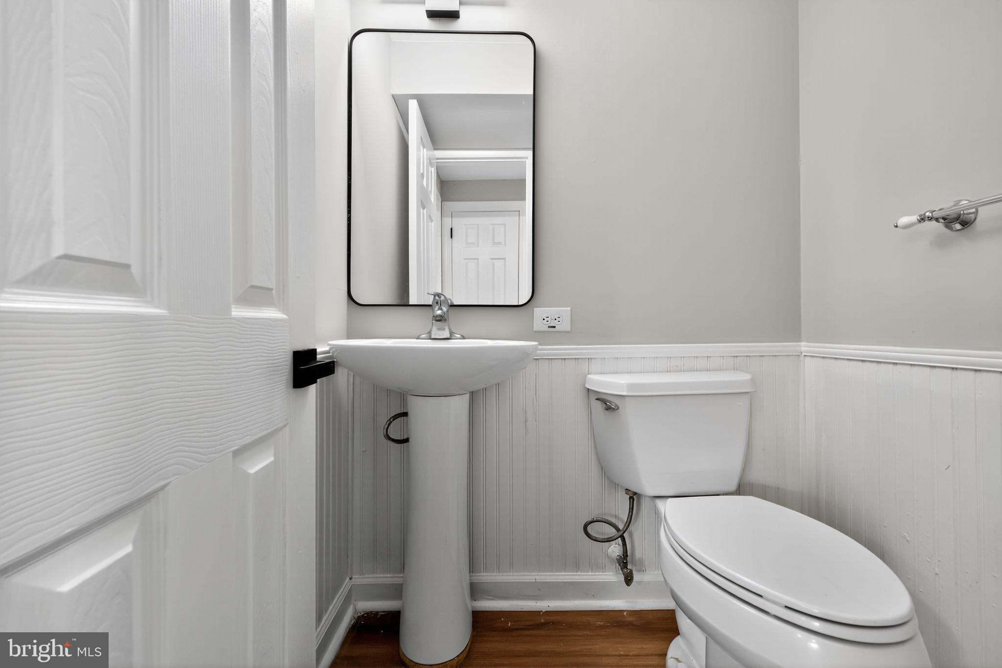 500 New York Road Browns Mills, NJ 08015 - Photo 20 of 21 a bathroom with a toilet a sink and mirror