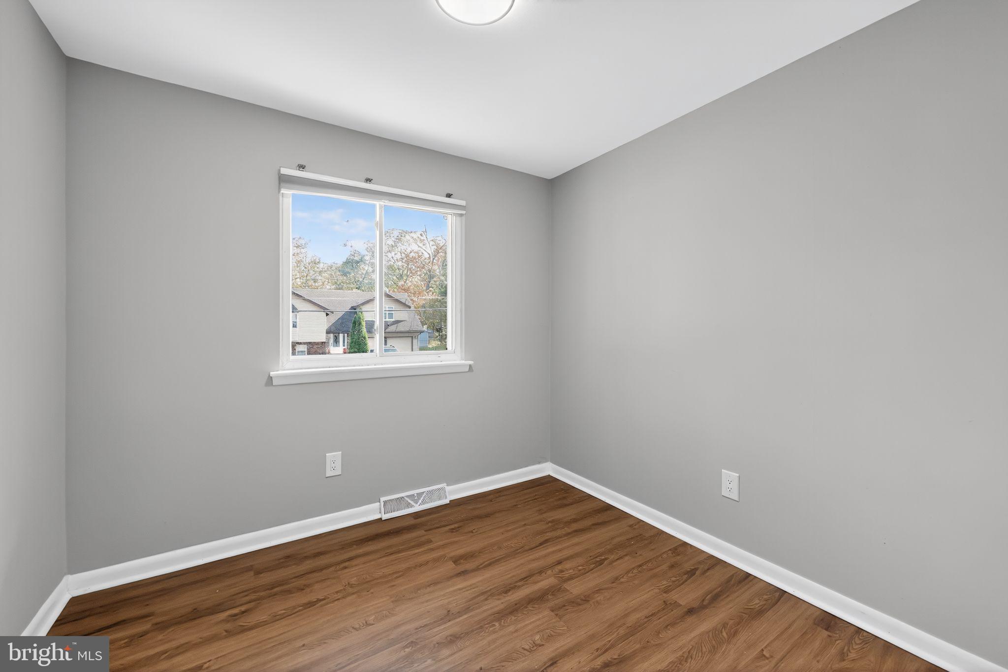 500 New York Road Browns Mills, NJ 08015 - Photo 10 of 21 a view of an empty room with wooden floor and a window