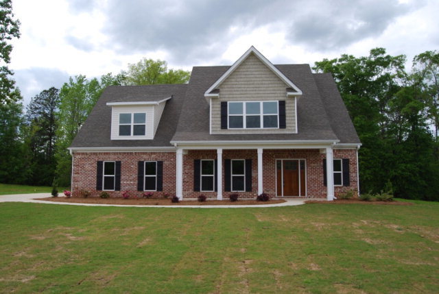 92 Carters Way Forsyth, GA 31029 - Photo 1 of 21 a front view of a house with garden
