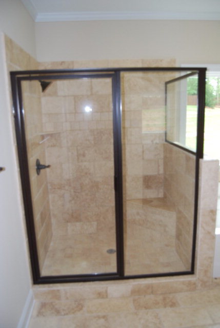 92 Carters Way Forsyth, GA 31029 - Photo 15 of 21 a bathroom with a glass shower door
