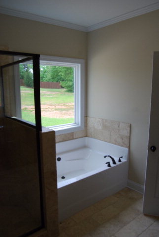 92 Carters Way Forsyth, GA 31029 - Photo 16 of 21 a bathroom with a tub and a window