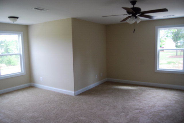 92 Carters Way Forsyth, GA 31029 - Photo 21 of 21 an empty room with a window and a fan