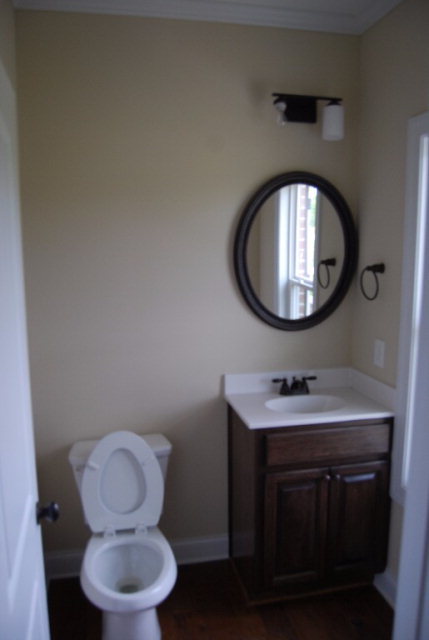 92 Carters Way Forsyth, GA 31029 - Photo 5 of 21 a bathroom with a toilet a sink and a mirror