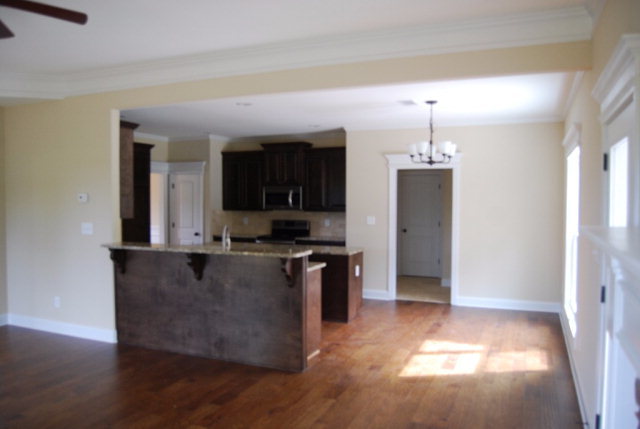 92 Carters Way Forsyth, GA 31029 - Photo 7 of 21 a kitchen with stainless steel appliances granite countertop a stove a sink and a refrigerator