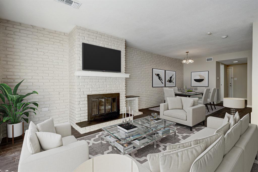 a living room with furniture fireplace and a flat screen tv