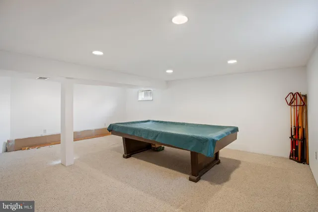 a room with furniture and air hockey table