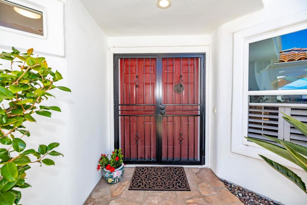 4939 Tilos Way Oceanside, CA 92056 - Photo 11 of 49 a view of a entryway door of the house