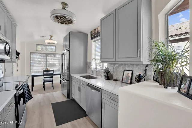 a bedroom with a bed and a chair