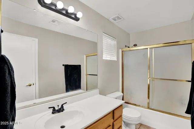 a view of a chairs and table in the backyard