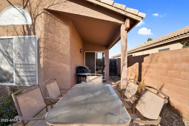an aerial view of a house with a yard and lake view