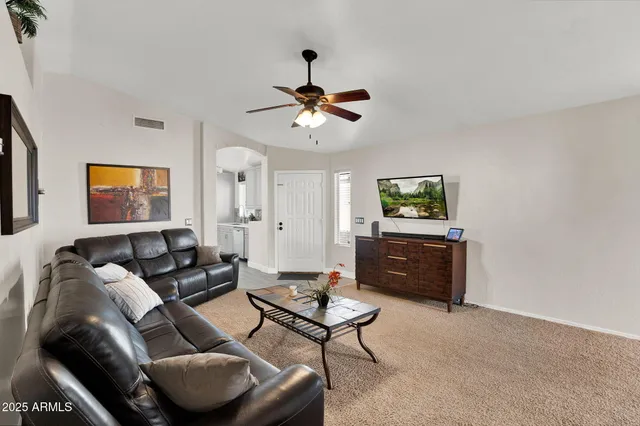 a kitchen with granite countertop white cabinets and stainless steel appliances