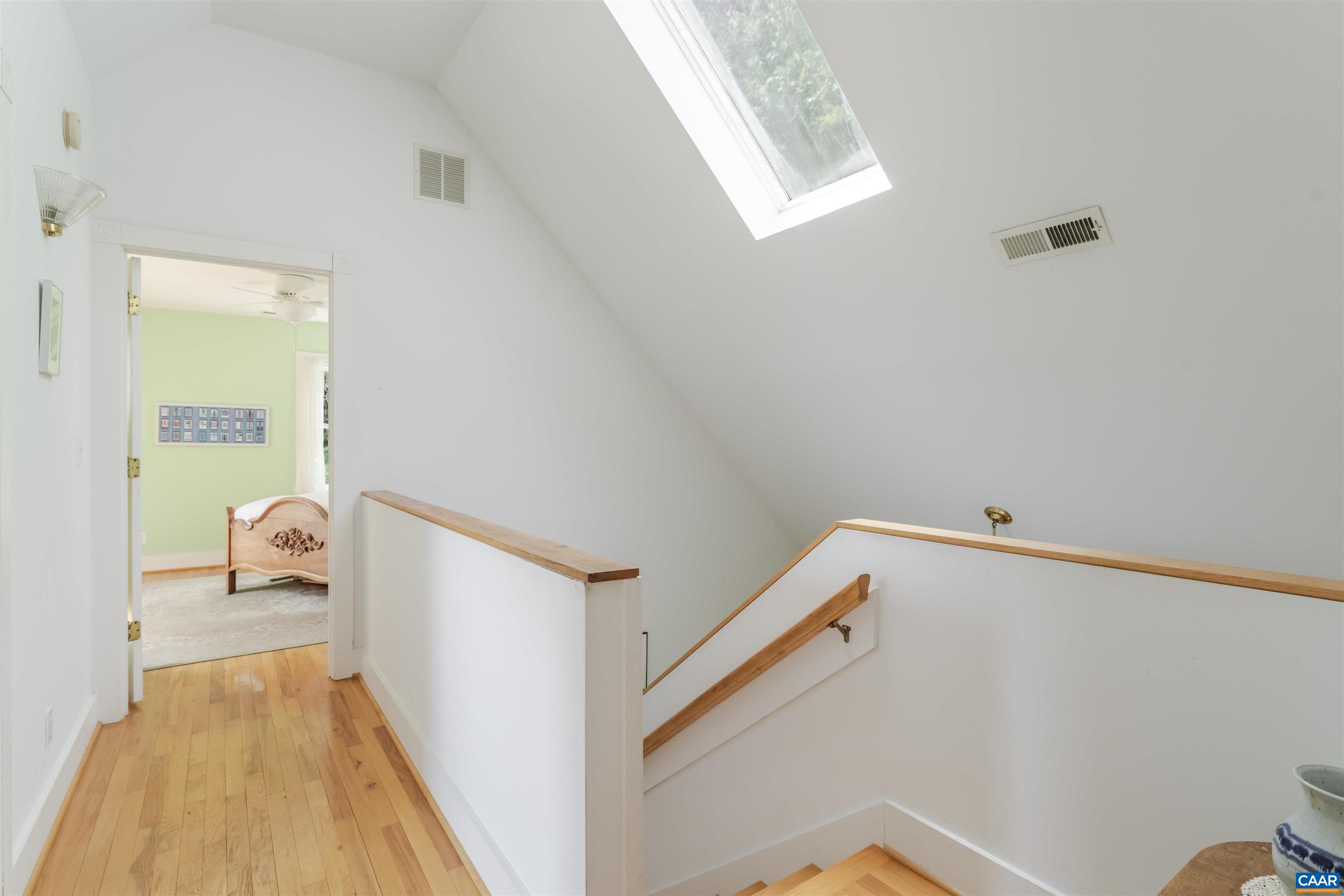 6630 Highlander Way Crozet, VA 22932 - Photo 17 of 41 a hallway with sliding door and wooden floor