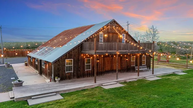 an aerial view of a house with outdoor space