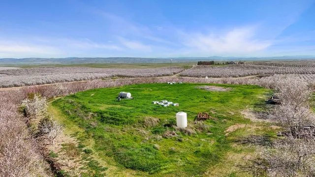 a view of a roof deck with couches and wooden floor