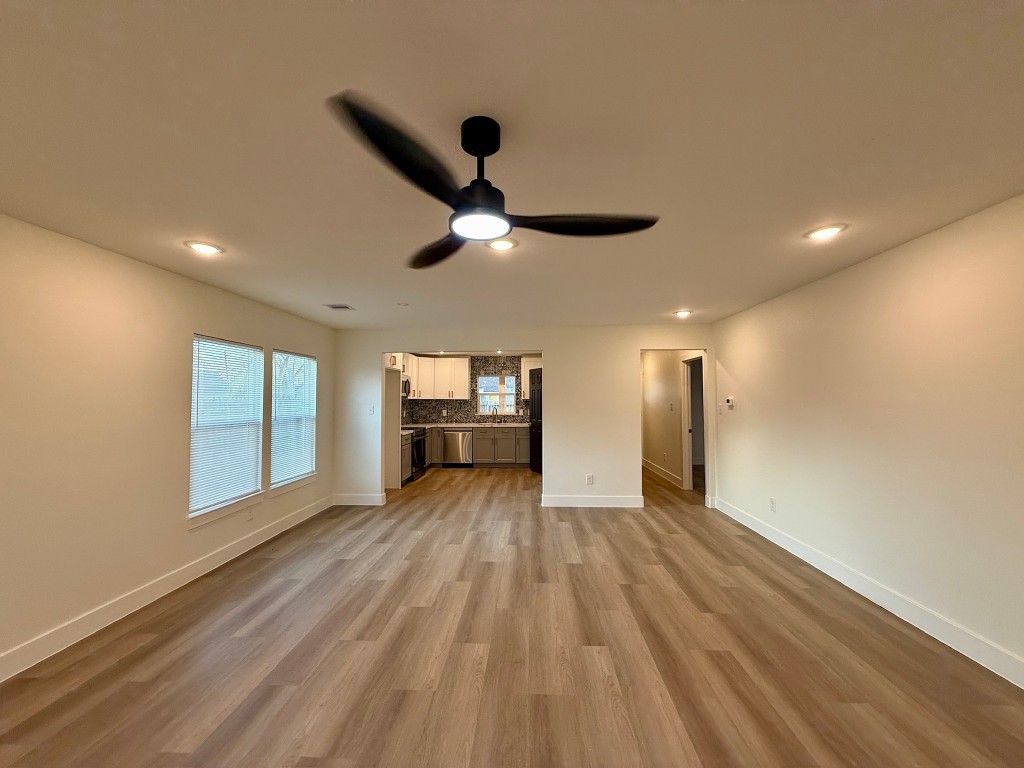 512 Morrell Street Baytown, TX 77520 - Photo 19 of 19 a view of empty room with wooden floor and window