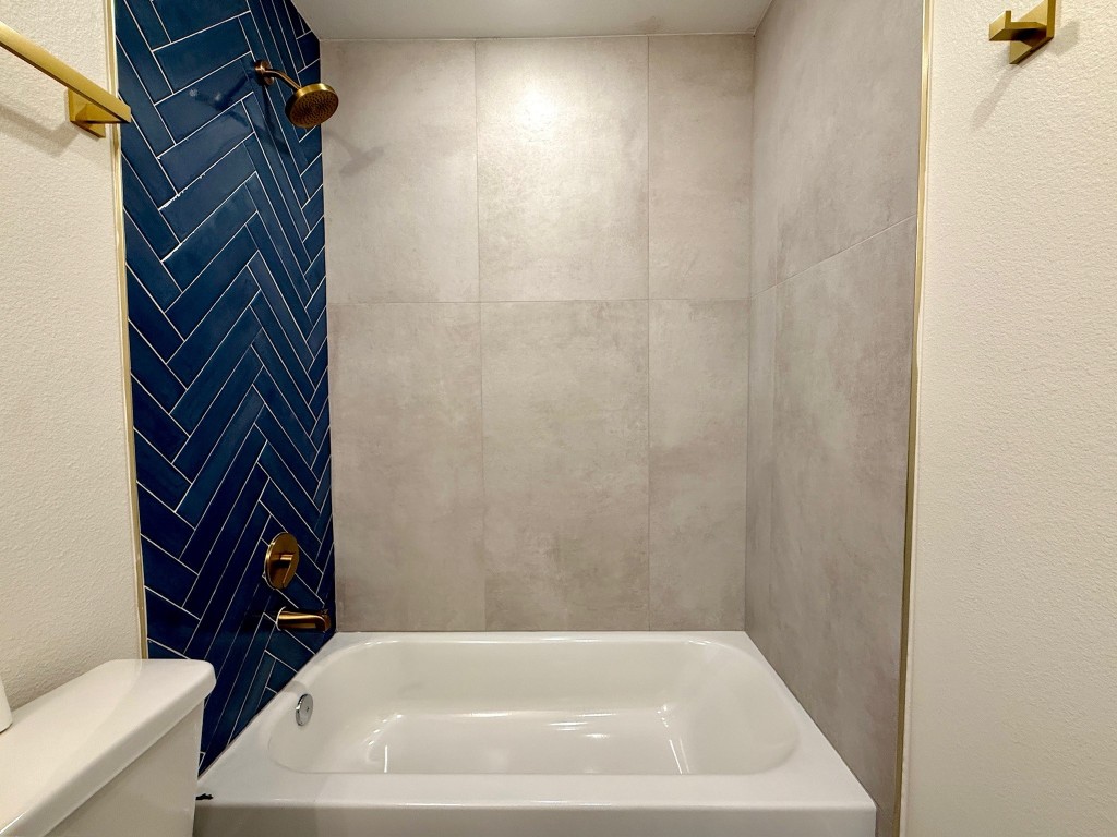 512 Morrell Street Baytown, TX 77520 - Photo 3 of 19 a bathroom with a bathtub