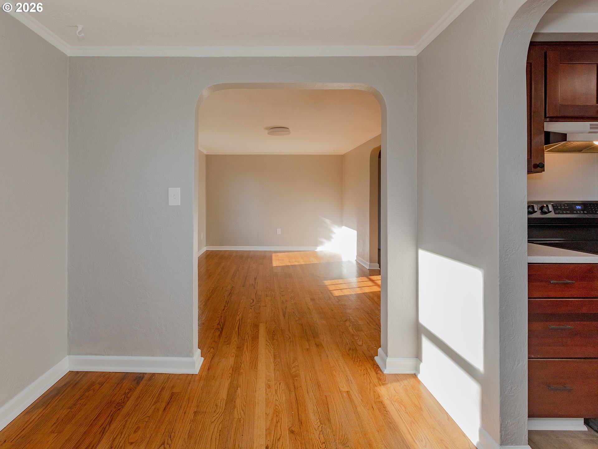 904 East 33rd Street Vancouver, WA 98663 - Photo 12 of 26 a view of a room with wooden floor and a hallway
