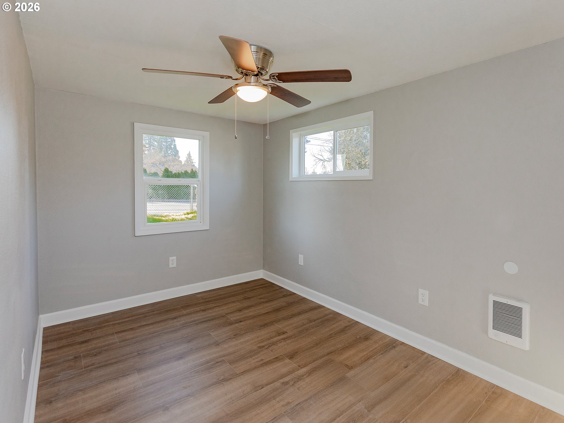 904 East 33rd Street Vancouver, WA 98663 - Photo 24 of 26 a view of an empty room with wooden floor and a window