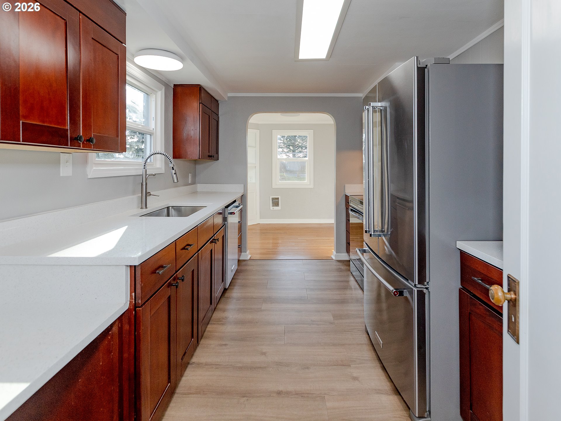 904 East 33rd Street Vancouver, WA 98663 - Photo 9 of 26 a kitchen with stainless steel appliances granite countertop a refrigerator and a sink
