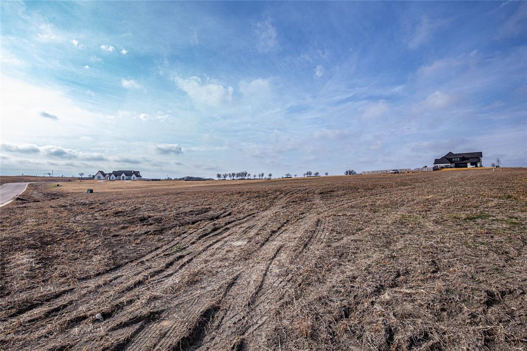 Tbd Tbd Queens Court Lorena, TX 76655 - Photo 4 of 4 a view of a road with an ocean
