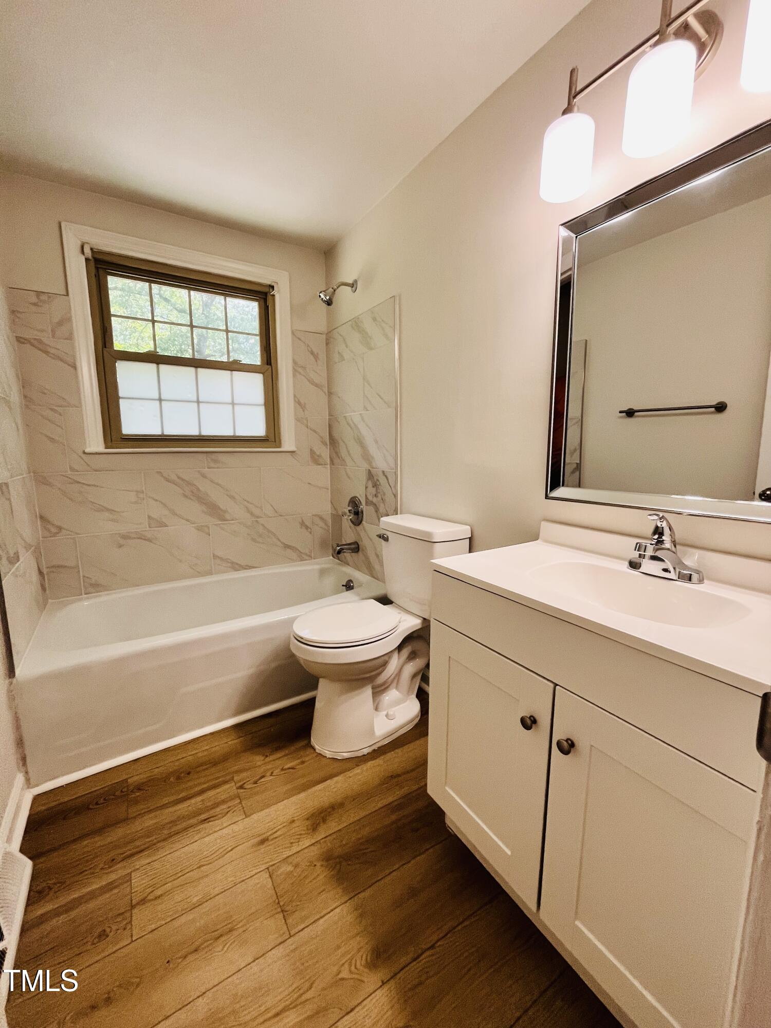 120 Dundee Road Fayetteville, NC 28303 - Photo 11 of 32 a bathroom with a double vanity sink a toilet and a bathtub