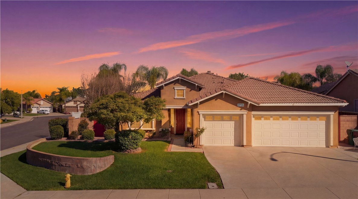 32124 Beaulieu Road Winchester, CA 92596 - Photo 1 of 1 a front view of a house with a garden and yard