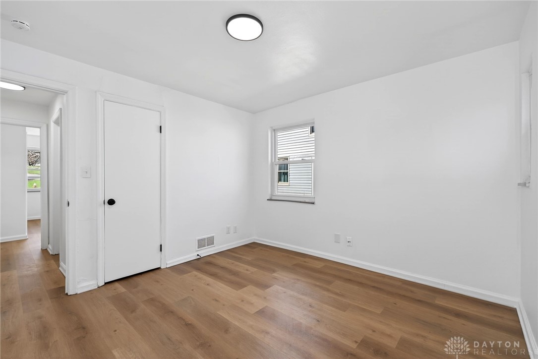 1243 Ridgeview Avenue Dayton, OH 45409 - Photo 26 of 56 This spacious room features rich wood flooring, crisp white walls, and abundant natural light.