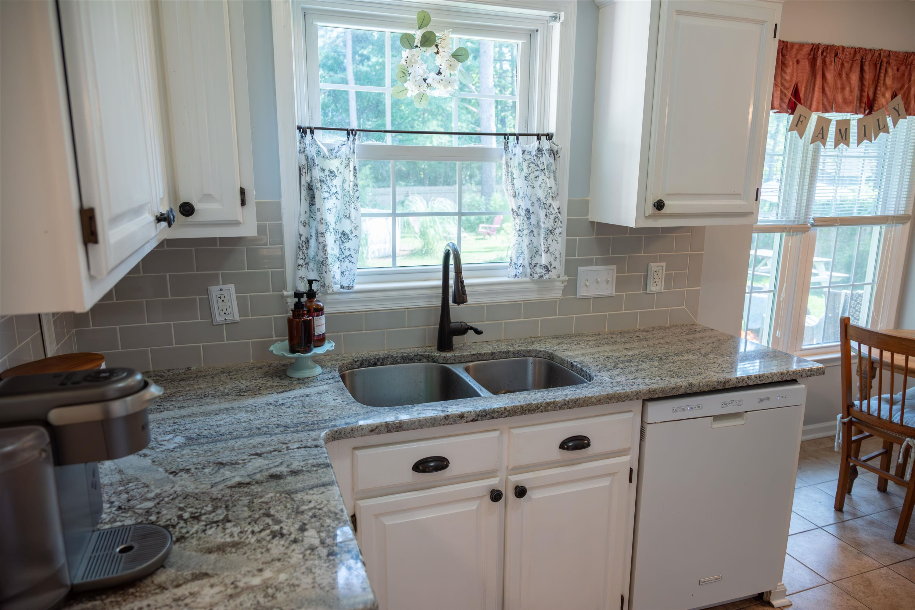1301 Buckhorn Road Garner, NC 27529 - Photo 11 of 24 a kitchen with granite countertop a sink and a window