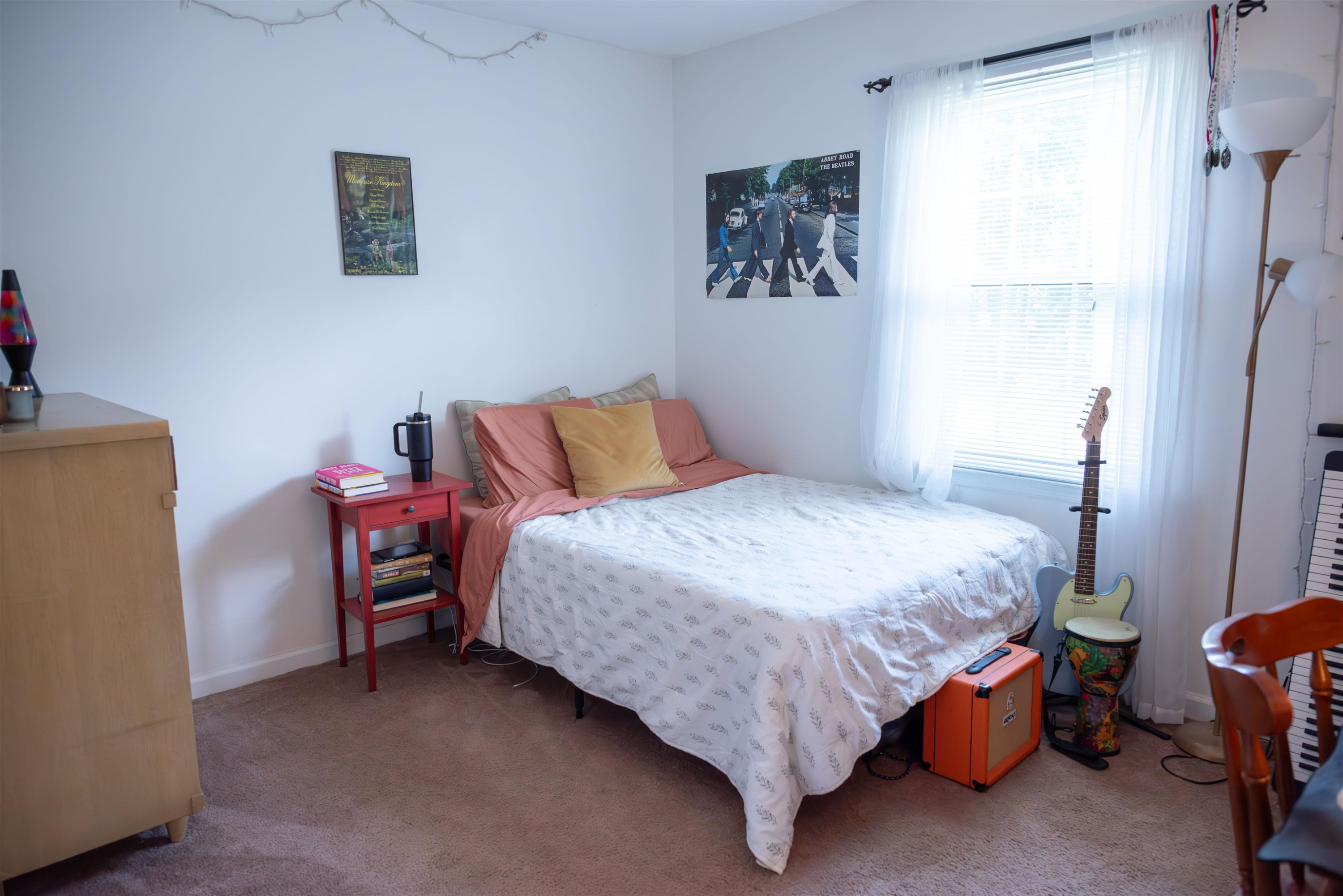 1301 Buckhorn Road Garner, NC 27529 - Photo 13 of 24 a bedroom with a bed and a table in it