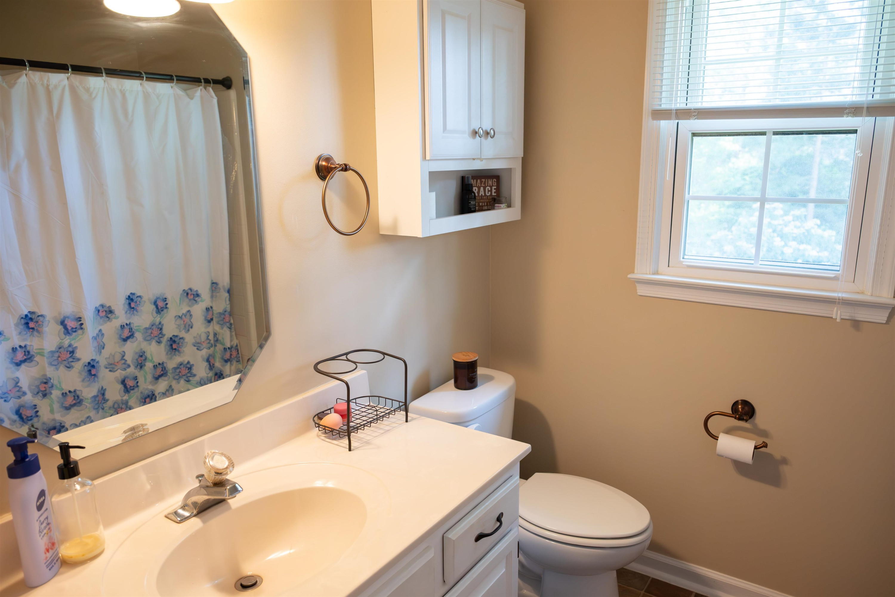 1301 Buckhorn Road Garner, NC 27529 - Photo 15 of 24 a bathroom with a sink toilet and mirror
