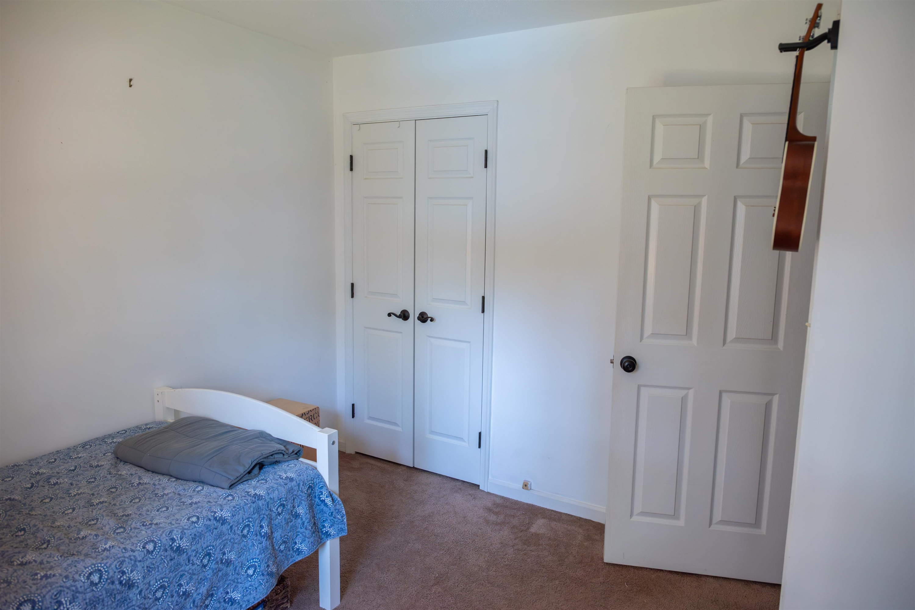 1301 Buckhorn Road Garner, NC 27529 - Photo 17 of 24 a bedroom with a bed and a shower