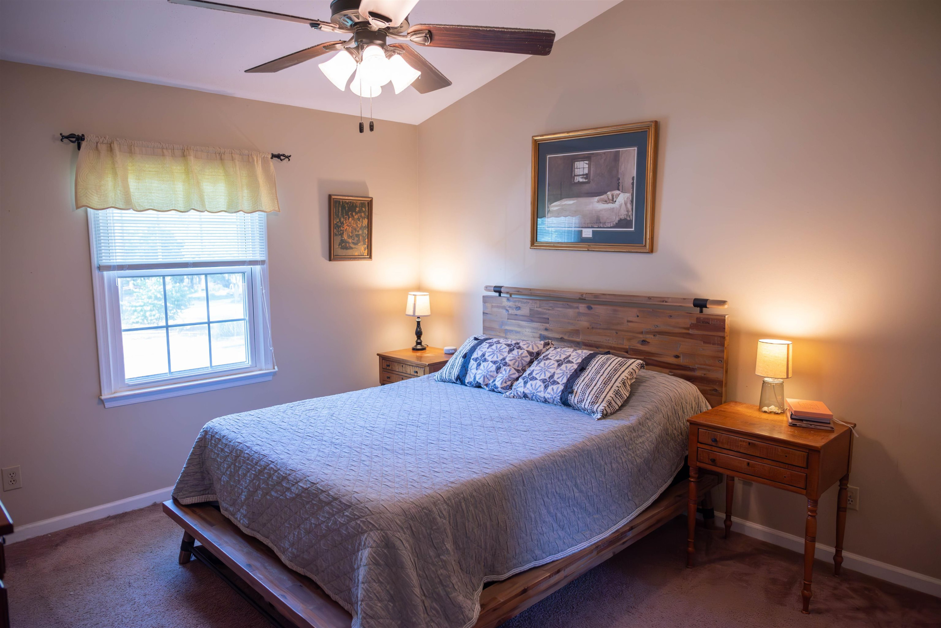1301 Buckhorn Road Garner, NC 27529 - Photo 18 of 24 a bedroom with a bed and a chandelier