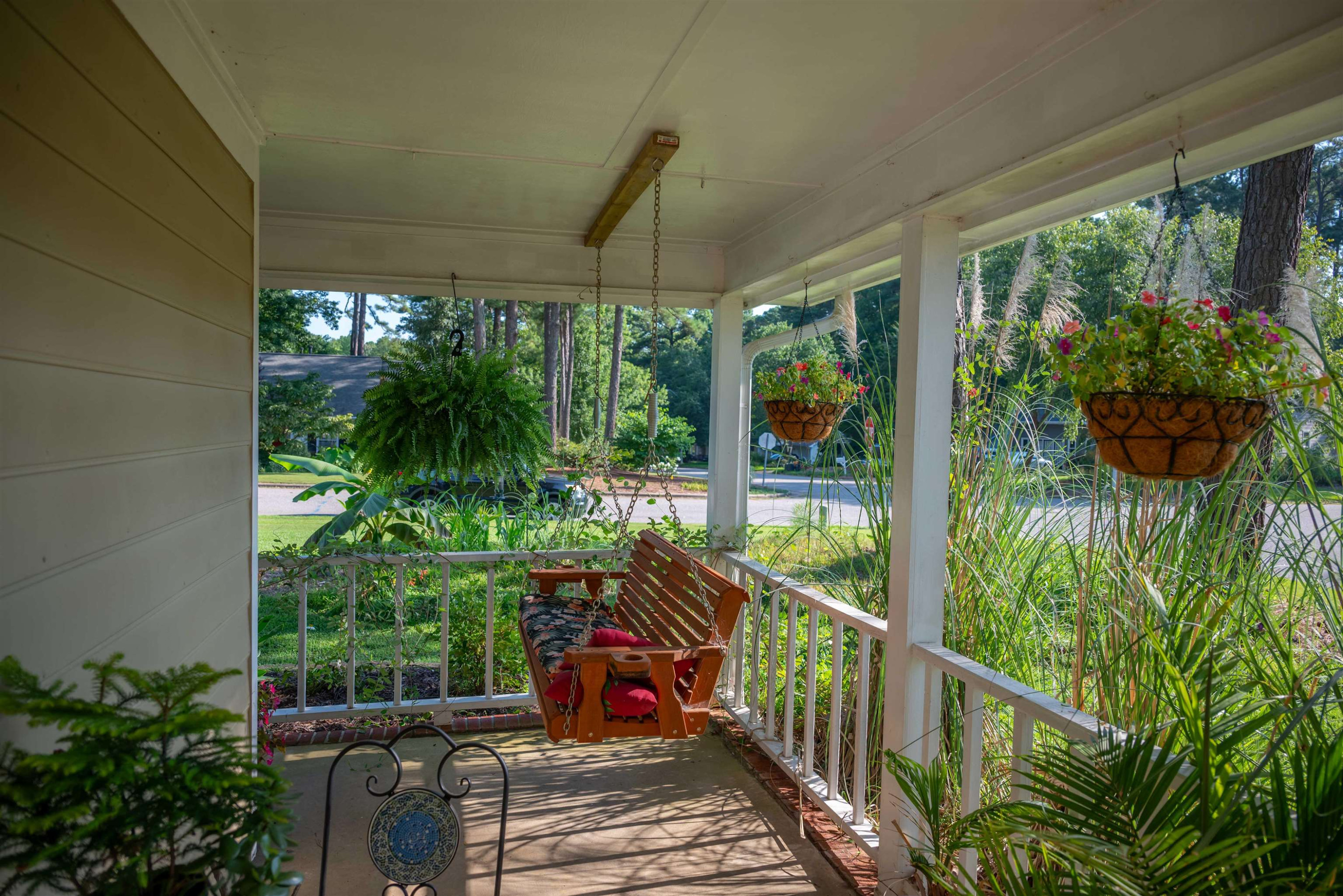 1301 Buckhorn Road Garner, NC 27529 - Photo 2 of 24 a balcony with trees in front of it