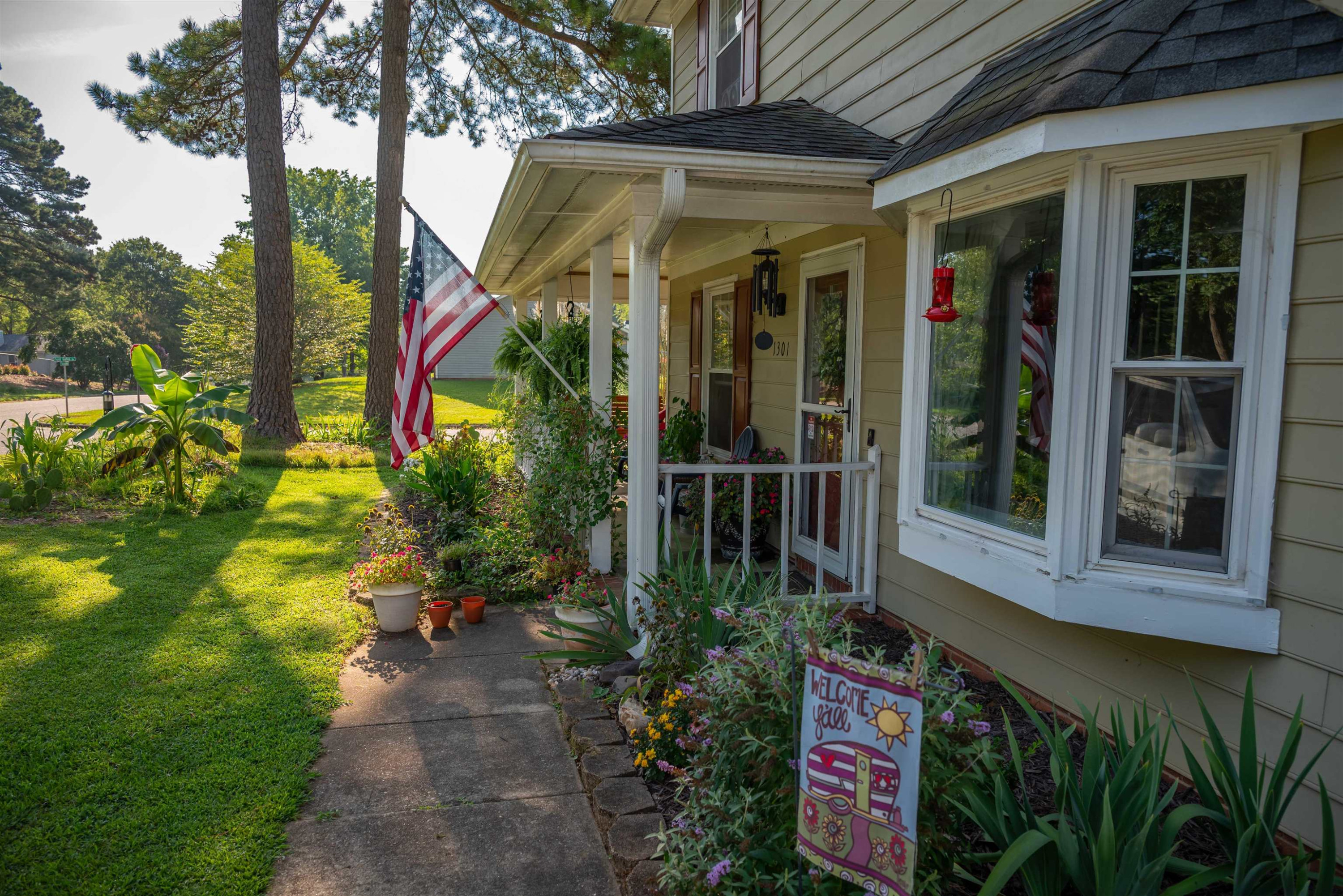 1301 Buckhorn Road Garner, NC 27529 - Photo 3 of 24 a view of a pathway that has a sign on it