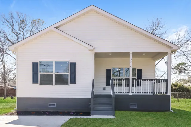a view of house with a roof deck