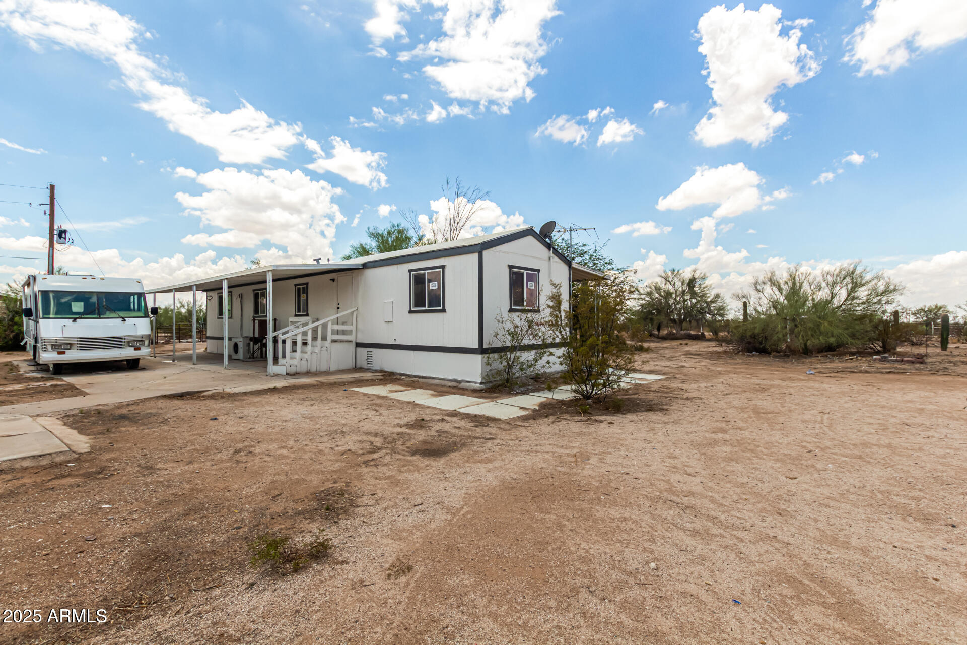 3663 North Thistle Drive Florence, AZ 85132 - Photo 12 of 29 a view of a house with backyard and a tree