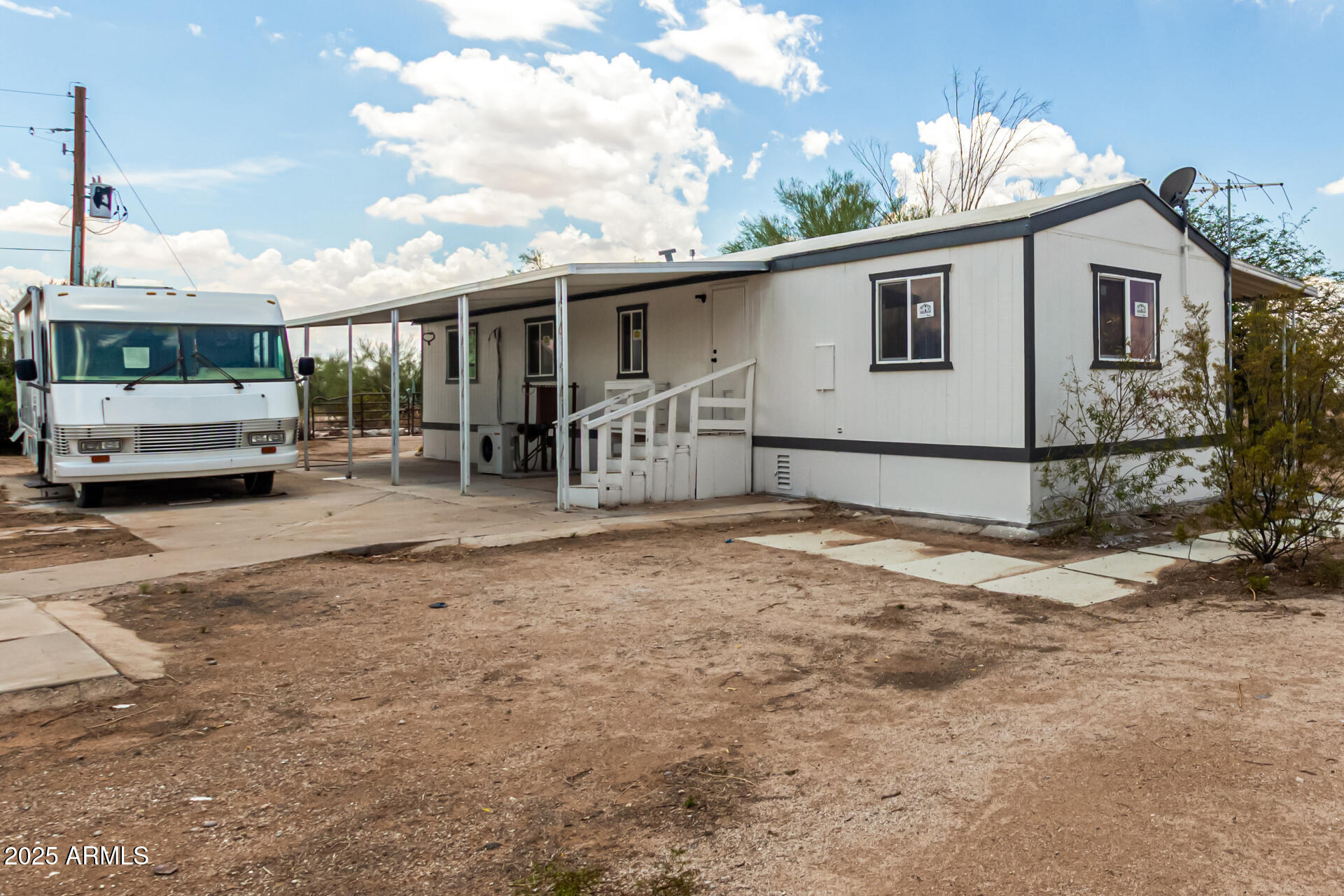 3663 North Thistle Drive Florence, AZ 85132 - Photo 13 of 29 a house view with a backyard space