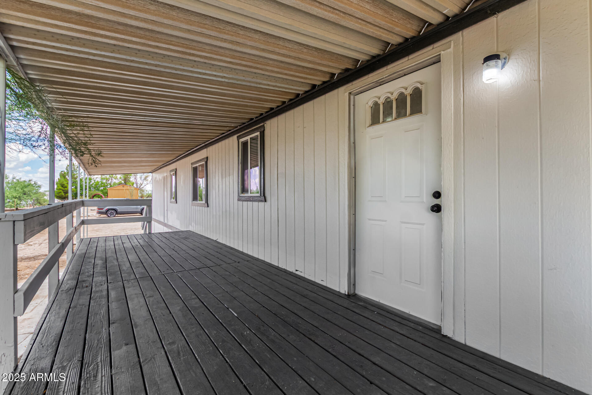3663 North Thistle Drive Florence, AZ 85132 - Photo 16 of 29 a view of backyard with wooden floor